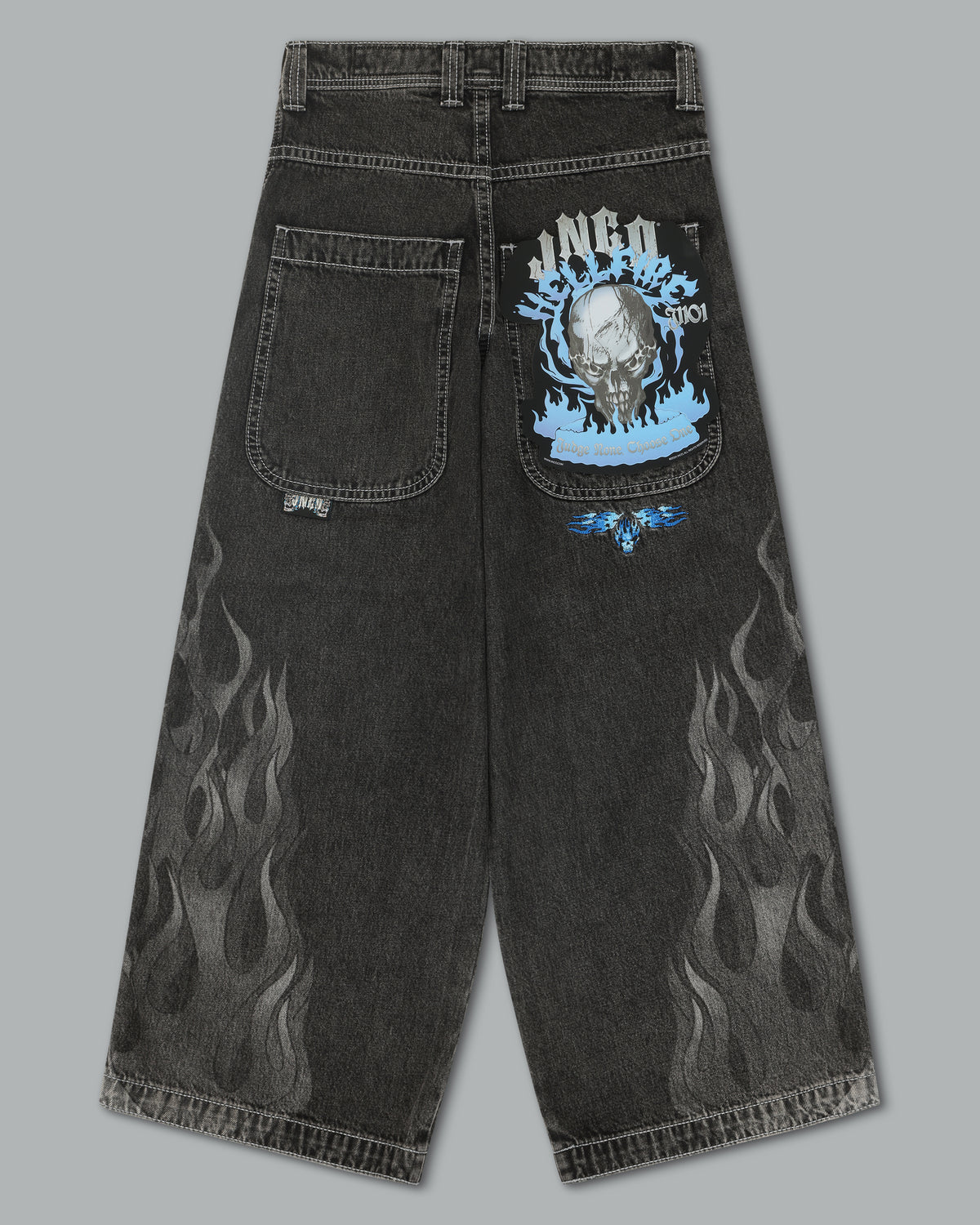 Back view of the flame jeans laid flat with a blue skull flasher card attached to the right back pocket